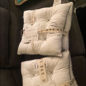 Four Rae Dunn kitchen cushions